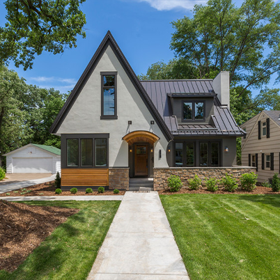 Tudor style home with black framed Andersen windows