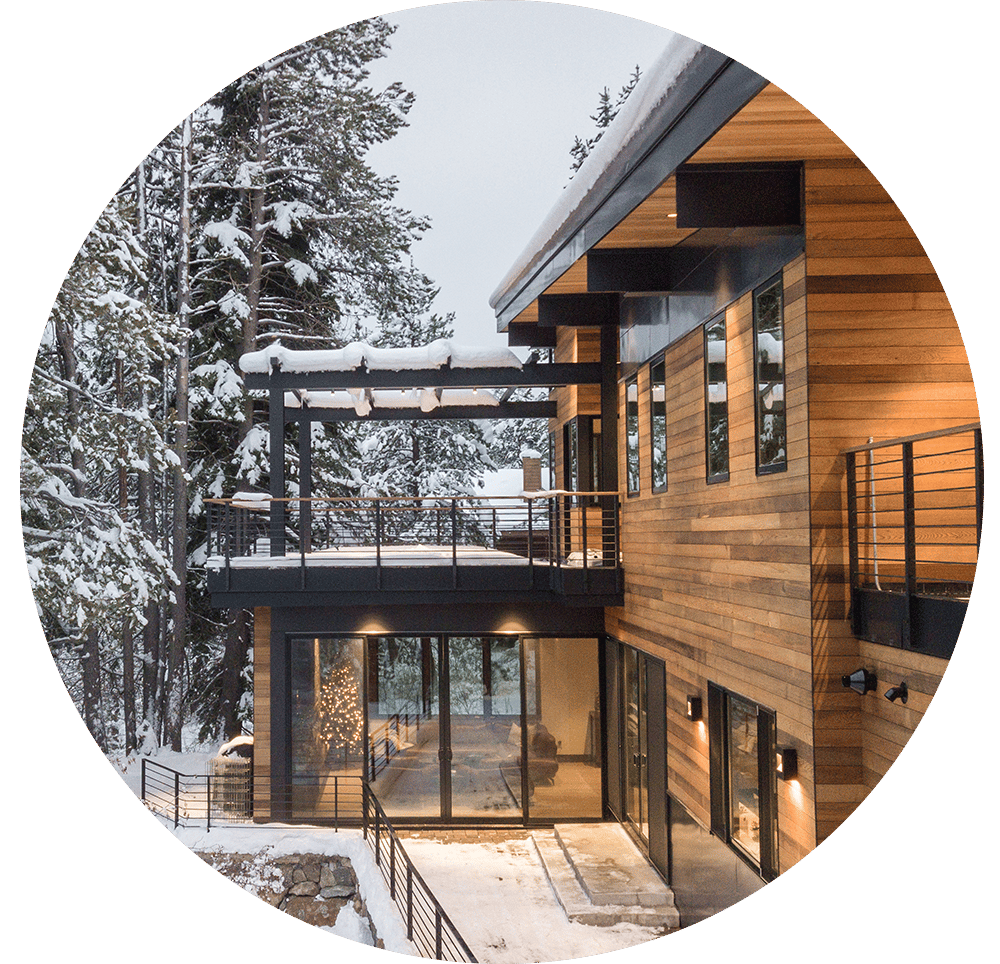 Modern style home with black windows in the winter